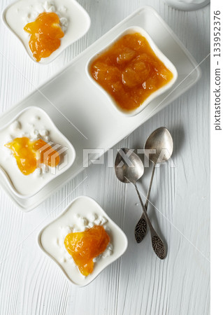 Cottage cheese with cream and mango jam. 133952376