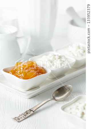 Mango jam and cottage cheese with cream. 133952379