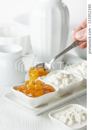 Mango jam and cottage cheese with cream. 133952380