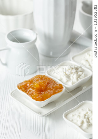 Apricot jam and cottage cheese with cream. 133952382