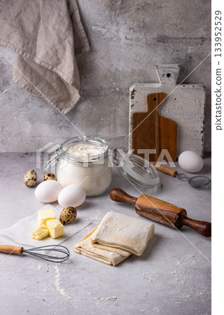 Raw puff pastry dough with baking ingredient Raw puff pastry dough with baking ingredient 133952529