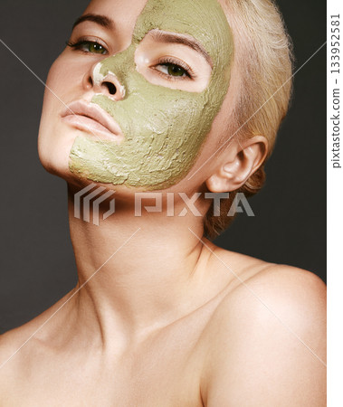 Beautiful Woman Applying Green Facial Mask. Beauty Treatments 133952581