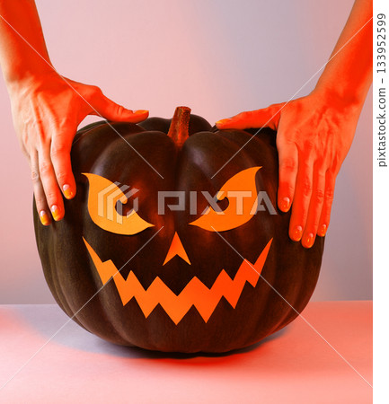 Halloween Pumpkin with Paper Cut Scary Face on a White Background. Jack Halloween. Smile Jack Pumpkin Halloween Pumpkin with Paper Cut Scary Face on a White Background. Jack Halloween. Smile Jack Pumpkin 133952599