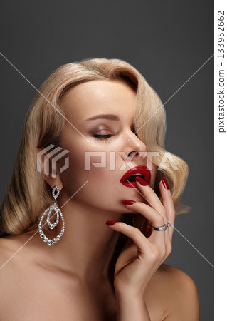 Beautiful Woman with Fashion Make-up and Blond Wave Hairstyle. Glamour American Diva Style with Brilliant Accessories Beautiful Woman with Fashion Make-up and Blond Wave Hairstyle. Glamour American Diva Style with Brilliant Accessories 133952662