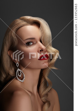 Beautiful Woman with Fashion Make-up and Blond Wave Hairstyle. Glamour American Diva Style with Brilliant Accessories Beautiful Woman with Fashion Make-up and Blond Wave Hairstyle. Glamour American Diva Style with Brilliant Accessories 133952663