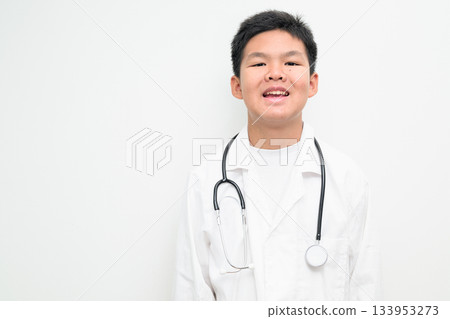 Young Asian Boy Dressed as Doctor with Stethoscope Smiling Young Asian Boy Dressed as Doctor with Stethoscope Smiling 133953273
