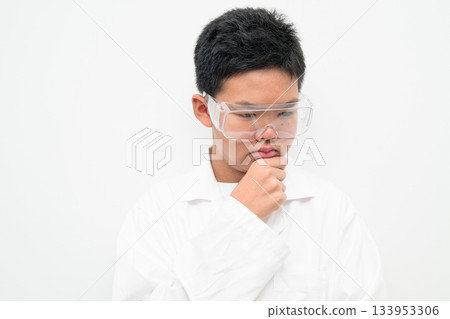 Pensive Young Asian Boy Dressed as Scientist with Lab Coat Thinking Pensive Young Asian Boy Dressed as Scientist with Lab Coat Thinking 133953306