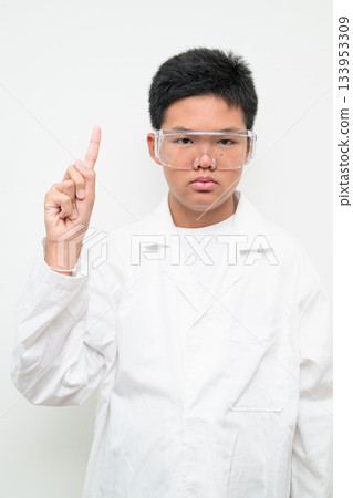 Young Asian Boy Dressed as Scientist with Lab Coat Pointing Finger Young Asian Boy Dressed as Scientist with Lab Coat Pointing Finger 133953309