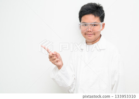 Young Asian Boy Dressed as Scientist with Lab Coat Pointing Finger 133953310