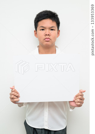 Asian Teenage Boy Student Studio Portrait on White Background Showing Empty Placard with Copy Space 133953369