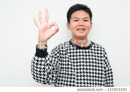 Asian Teenage Boy Studio Portrait on White Background OK Hand Gesture Perfect Approval Sign Asian Teenage Boy Studio Portrait on White Background OK Hand Gesture Perfect Approval Sign 133953395