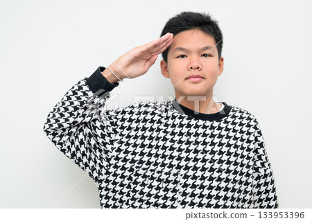 Asian Teenage Boy Studio Portrait on White Background Saluting Hand Gesture Respectful Greeting 133953396