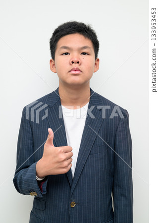 Asian Teenage Boy in Suit Studio Portrait Thumbs Up Approval Success Gesture Asian Teenage Boy in Suit Studio Portrait Thumbs Up Approval Success Gesture 133953453