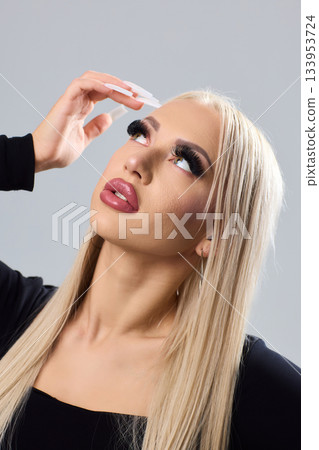 Sophisticated portrait of poised woman in professional studio environment, Refined image showcasing confident lady with braided hairstyle dressed elegantly against studio backdrop Sophisticated portrait of poised woman in professional studio environment, Refined image showcasing confident lady with braided hairstyle dressed elegantly against studio backdrop 133953724