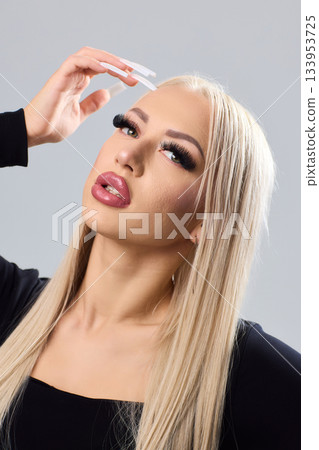 Sophisticated portrait of poised woman in professional studio environment, Refined image showcasing confident lady with braided hairstyle dressed elegantly against studio backdrop Sophisticated portrait of poised woman in professional studio environment, Refined image showcasing confident lady with braided hairstyle dressed elegantly against studio backdrop 133953725