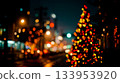 A Christmas tree in the middle of a city at night 133953920
