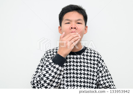 Asian Teenage Boy Studio Portrait on White Background Tired Yawning Asian Teenage Boy Studio Portrait on White Background Tired Yawning 133953942