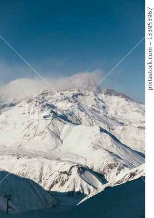 Snowy mountain landscape in Gudauri Georgia with clear skies and distant peaks 133953967