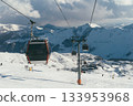 Ski lift in Gudauri, Georgia, transporting skiers through snowy mountains 133953968