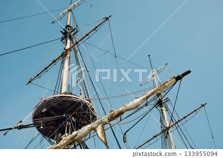 replica of a huge antique wooden frigate, thick ropes, reflections in the glossy sides of boats, huge masts replica of a huge antique wooden frigate, thick ropes, reflections in the glossy sides of boats, huge masts 133955094