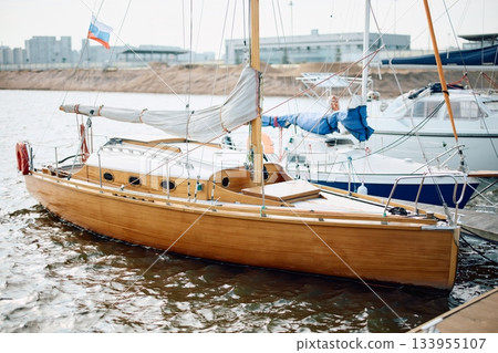 The old wooden sailboat moored in yacht club, calm water in the Gulf of Finland 133955107