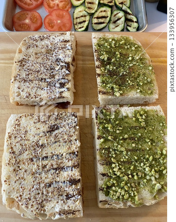 Golden, crispy toast topped with butter and jam, perfect for breakfast or snack-related projects. This image captures the warmth and comfort of a simple yet satisfying meal. 133956307