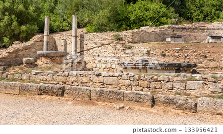 Ruins of the Nymphaion (or Nymphaeum) a monumental fountain in ancient Olympia, Greece 133956421