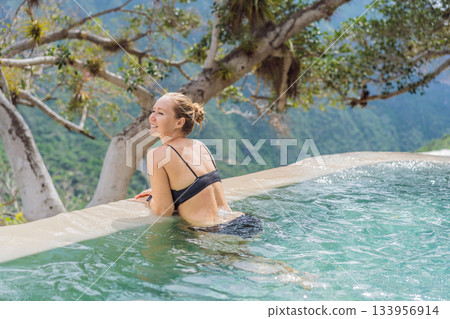 Female tourist exploring Grutas Tolantongo in Mexico, enjoying natural hot springs, scenic caves, and outdoor adventure. Travel, wellness, and sightseeing concept 133956914