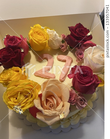 Elegant cake topped with delicate edible flower decorations, offering a perfect blend of soft, sweet layers and natural floral beauty in every slice, ideal for celebrations and special moments. 133957041