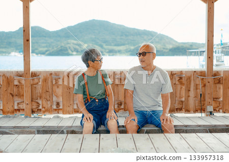 Senior couple enjoying a foot bath Senior couple enjoying a foot bath 133957318