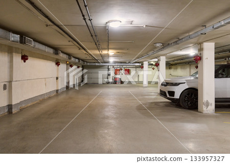 Underground parking ambiance, Underground garage showcasing contemporary design and security elements Underground parking ambiance, Underground garage showcasing contemporary design and security elements 133957327