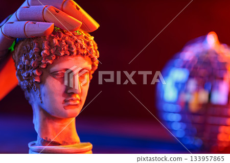 Sculpture Bust with Disco Ball and Wooden Hand in Neon Light 133957865
