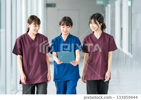 Female staff of doctors, physicians, nurses, medical professionals, doctors, occupational therapists and physical therapists wearing scrubs Female staff of doctors, physicians, nurses, medical professionals, doctors, occupational therapists and physical therapists wearing scrubs 133959444