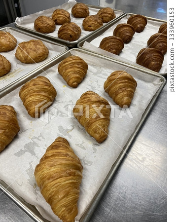 A croissant is a classic French pastry known for its buttery, flaky layers and golden crust. Often enjoyed plain or filled with chocolate, almond, or ham and cheese, it’s a perfect for breakfast A croissant is a classic French pastry known for its buttery, flaky layers and golden crust. Often enjoyed plain or filled with chocolate, almond, or ham and cheese, it’s a perfect for breakfast 133960153