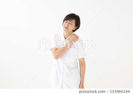 A worried woman in a white coat 133960194