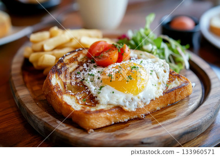 Breakfast with french bread toasted with hot coffee on the plate on table. 133960571
