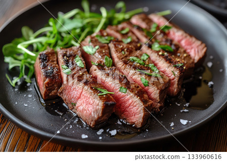 Juicy roasted beef slices garnished with fresh rosemary and colorful peppercorns Juicy roasted beef slices garnished with fresh rosemary and colorful peppercorns 133960616