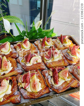 A croissant is a classic French pastry known for its buttery, flaky layers and golden crust. Often enjoyed plain or filled with chocolate, almond, or ham and cheese, it’s a perfect for breakfast 133961539