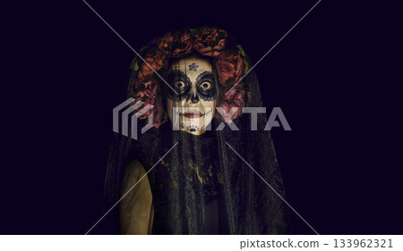 Portrait of lady dressed in spooky Catrina costume on Halloween or Day of the Dead Portrait of lady dressed in spooky Catrina costume on Halloween or Day of the Dead 133962321