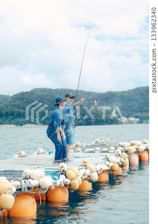 Senior couple enjoys fishing after catching a fish 133962340