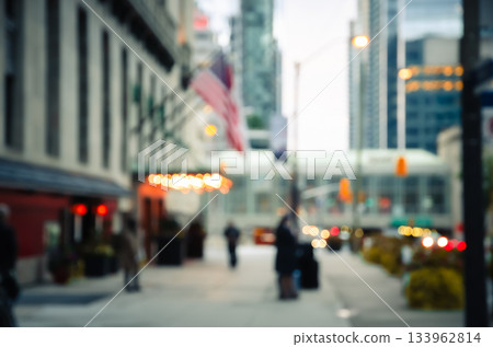 Abstract blurred vibrant city street with modern urban building and glowing bokeh lights background Abstract blurred vibrant city street with modern urban building and glowing bokeh lights background 133962814