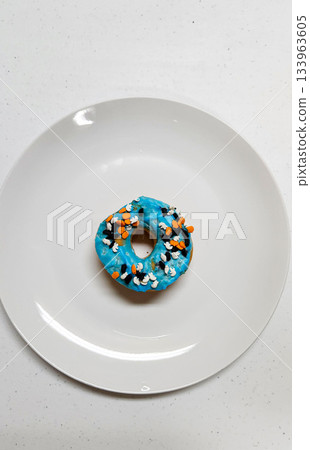 Three Colorful Donuts With Sprinkles  133963605