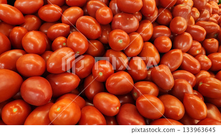 Fresh Red Cherry Tomatoes Piled High, Small Grape Tomatoes for Market and Cooking 133963645