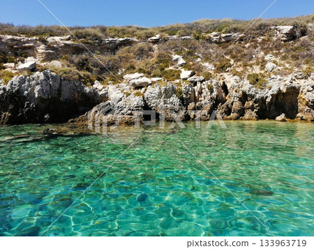 Crystal Clear Sea with Rocky Coast 133963719