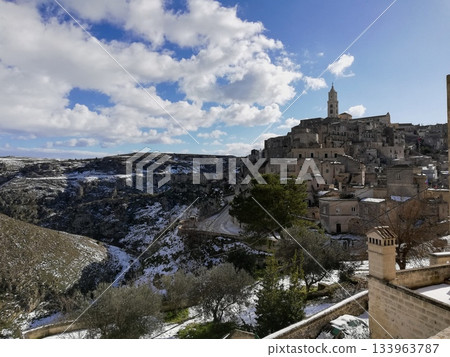 Stone Cityscape of Matera under Cloudy Sky Stone Cityscape of Matera under Cloudy Sky 133963787
