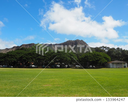 A symbol of Hawaii: the majestic Diamond Head and blue sky seen from Kapiolani Park A symbol of Hawaii: the majestic Diamond Head and blue sky seen from Kapiolani Park 133964247