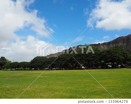 A symbol of Hawaii: the majestic Diamond Head and blue sky seen from Kapiolani Park A symbol of Hawaii: the majestic Diamond Head and blue sky seen from Kapiolani Park 133964278