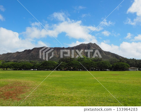A symbol of Hawaii: the majestic Diamond Head and blue sky seen from Kapiolani Park A symbol of Hawaii: the majestic Diamond Head and blue sky seen from Kapiolani Park 133964283