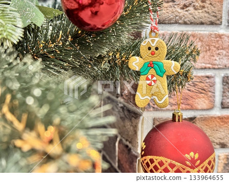 Bright Christmas Tree toys are hanging on the tree 133964655