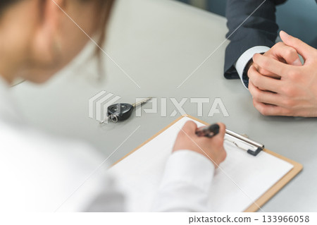 Customers filling out questionnaires, medical questionnaires, and counseling sheets Customers filling out questionnaires, medical questionnaires, and counseling sheets 133966058